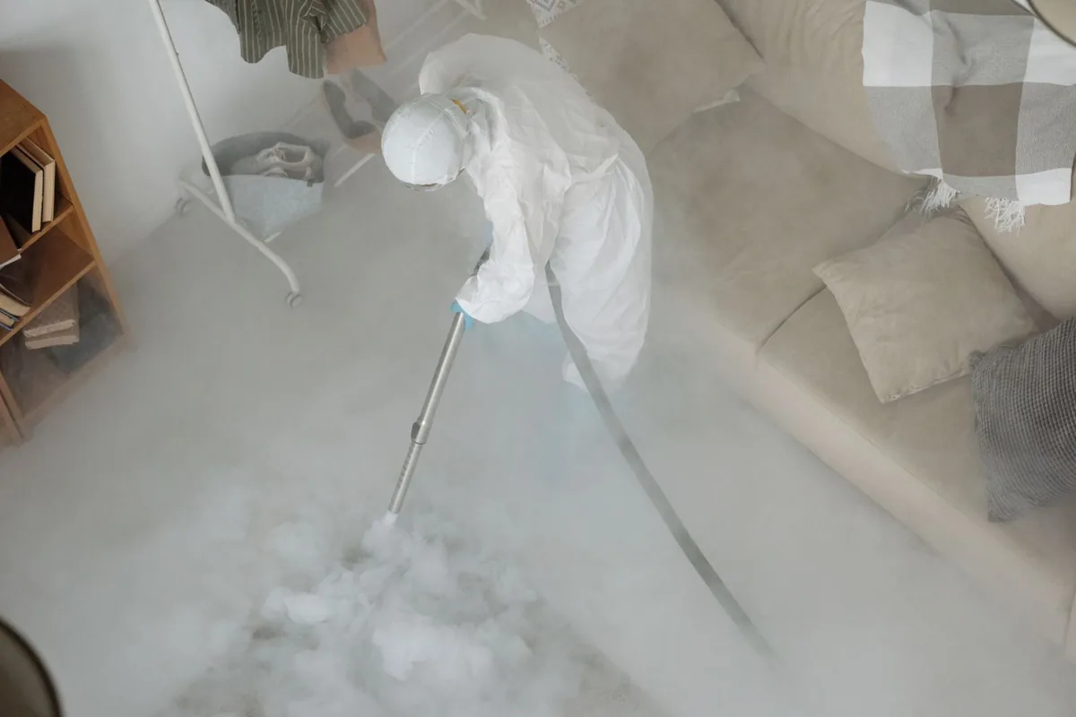 Biohazard cleanup technician in protective equipment, Barelas, Albuquerque, NM